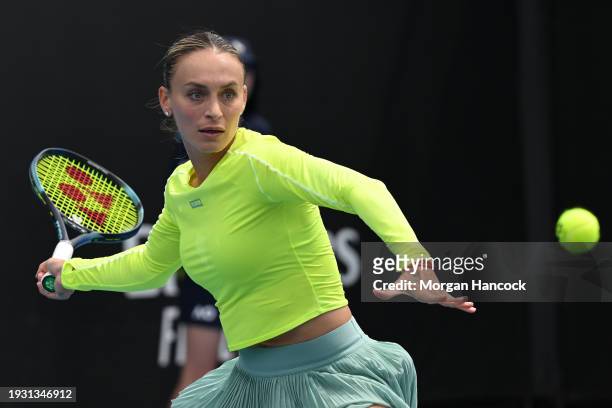 Ana Bogdan of Romania plays a forehand in their round one singles match against Linda Fruhvirtova of the Czech Republic during day one of the 2024...