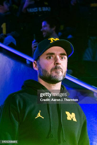 Defensive Coordinator Jesse Minter of the Michigan Wolverines walks out the tunnel before the National Championship Celebration at Crisler Center on...