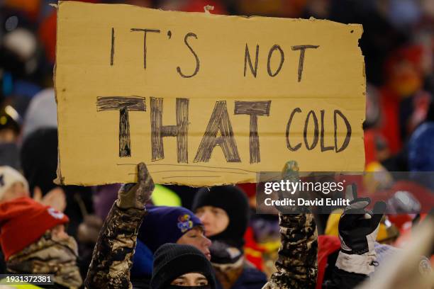 Fan holds a sign during the AFC Wild Card Playoffs between the Miami Dolphins and the Kansas City Chiefs at GEHA Field at Arrowhead Stadium on...