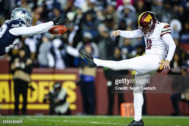 Peyton Hendershot of the Dallas Cowboys blocks the punt of Tress Way of the Washington Commanders during the second half of the game at FedExField on...