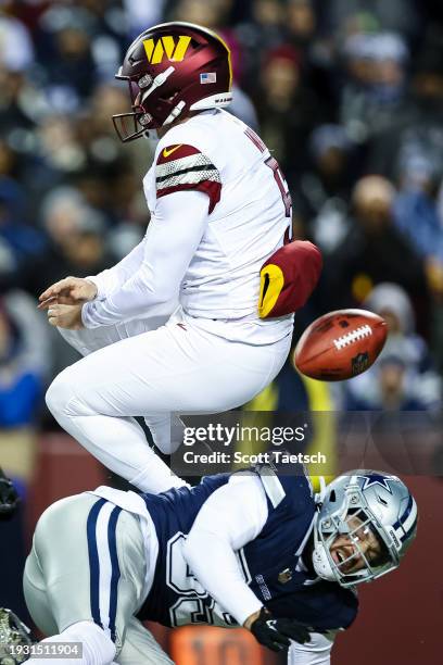 Peyton Hendershot of the Dallas Cowboys blocks the punt of Tress Way of the Washington Commanders during the second half of the game at FedExField on...