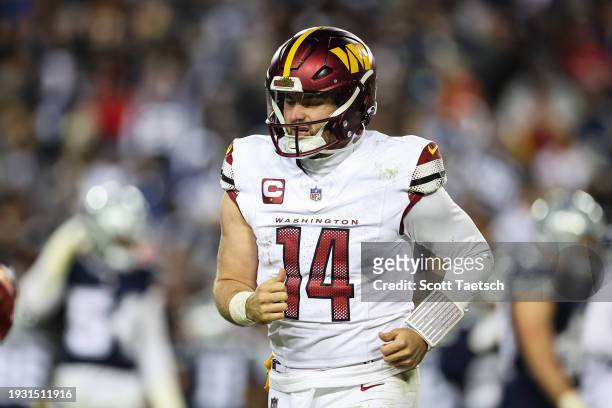 Sam Howell of the Washington Commanders looks on after being sacked by the Dallas Cowboys during the second half of the game at FedExField on January...