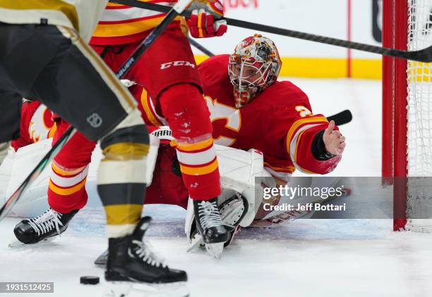 Jacob Markstrom of the Calgary Flames defends the net from the Vegas Golden Knights attack during the third period at T-Mobile Arena on January 13,...