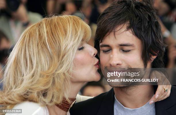 Mexican actress Laura Harring kisses her fellow actor Gael Garcia Bernal during a photo call for British director James Marsh's film "The King", 15...