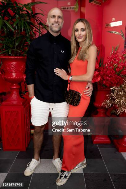 Chris Judd and Rebecca Judd attend the Piper-Heidsieck AO24 launch event at Melbourne Park on January 14, 2024 in Melbourne, Australia.