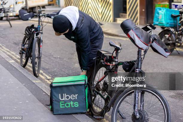 Food delivery courier for Uber Eats fulfils his orders in Soho, London, UK, on Tuesday, Jan. 16, 2024. Food delivery companies have struggled to...