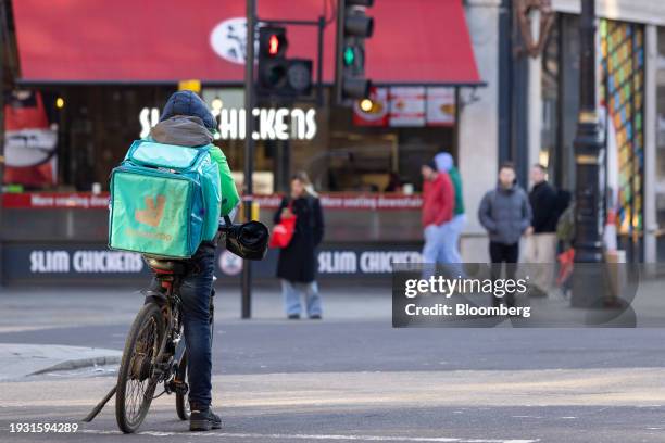 Food delivery courier working for Deliveroo Plc in central London, UK, on Tuesday, Jan. 16, 2024. Food delivery companies have struggled to return to...