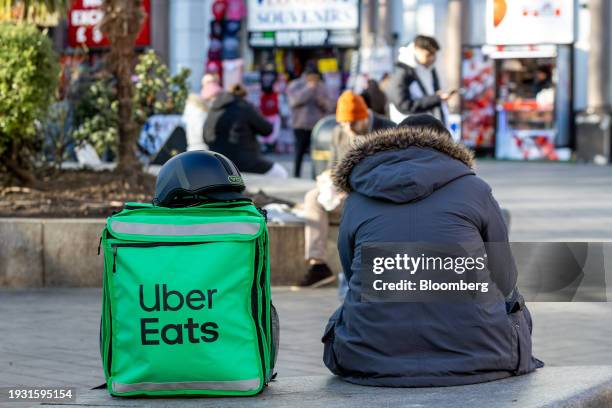 Food delivery courier working for Uber Eats waits for an order in London, on Tuesday, Jan. 16, 2024. Food delivery companies have struggled to return...