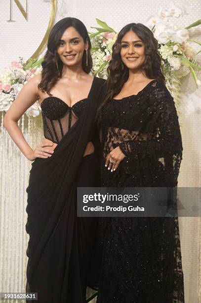 Manushi Chhillar and Mrunal Thakur attend the Nupur Shikhare and Ira Khan wedding reception on January 13, 2024 in Mumbai, India.