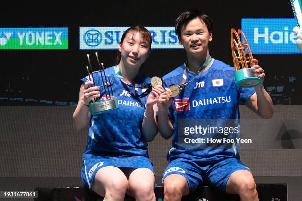 Yuta Watanabe and Arisa Higashino of Japan poses at the victory ceremony against Jiang Zhen Bang and We Ya Xin of China in their mixed doubles final...