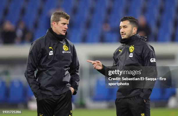 Assistant coach Sven Bender of Borussia Dortmund and Assistant coach Nuri Sahin of Borussia Dortmund look on ahead of the Bundesliga match between SV...