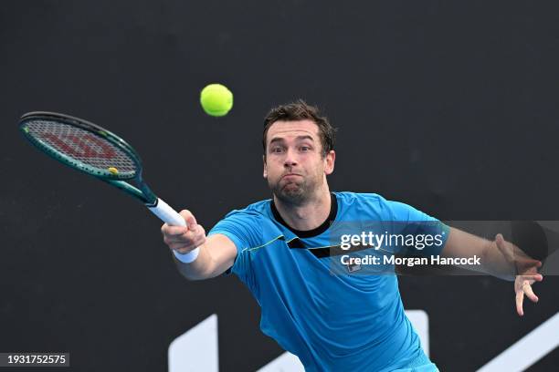 Quentin Halys of France plays a forehand in their round one singles match against Lloyd Harris of South Africa during day one of the 2024 Australian...