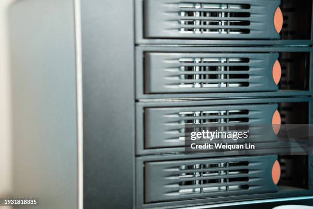 server hard disk cabinet - mainframe computer system stock pictures, royalty-free photos & images