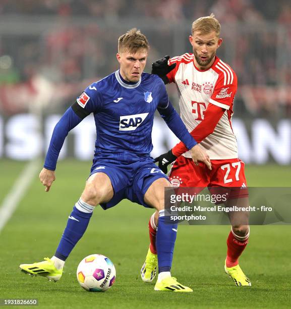 Marius Bülter of TSG Hoffenheim and Konrad Laimer of FC Bayern München compete for the ball during the Bundesliga match between FC Bayern München and...