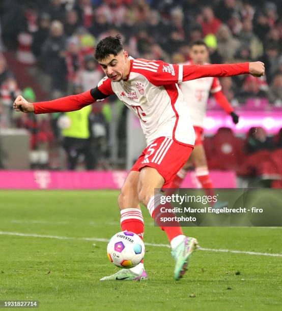 Aleksandar Pavlovic of FC Bayern München plays the ball during the Bundesliga match between FC Bayern München and TSG Hoffenheim at Allianz Arena on...