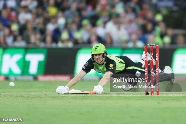Cameron Bancroft of the Thunder dives to avoid a runout during the BBL match between Sydney Thunder and Adelaide Strikers at Manuka Oval, on January...