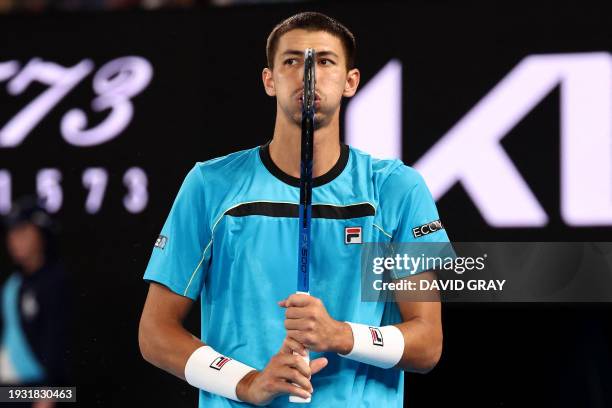 Australia's Alexei Popyrin reacts on a point against Serbia's Novak Djokovic during their men's singles match on day four of the Australian Open...