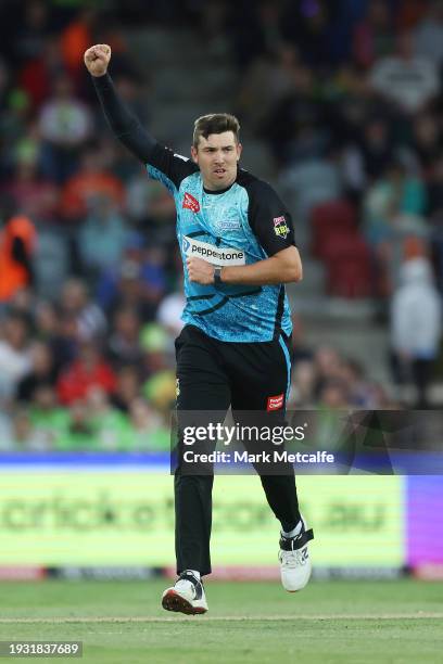 Jamie Overton of the Strikers celebrates taking the wicket of Oliver Davies of the Thunder during the BBL match between Sydney Thunder and Adelaide...