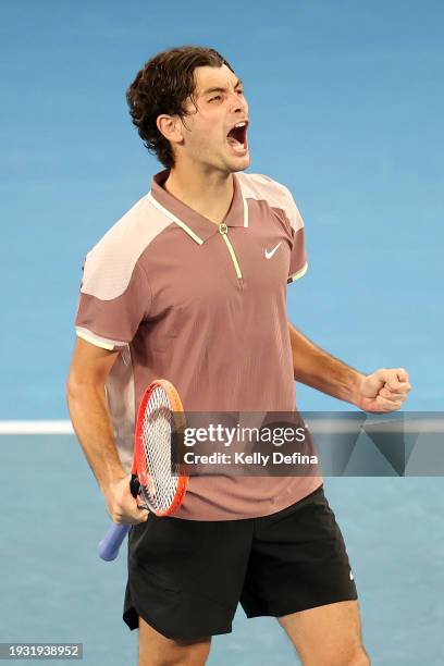 Taylor Fritz of the United States celebrates match point in their round one singles match against Facundo Diaz Acosta of Argentina during day one of...