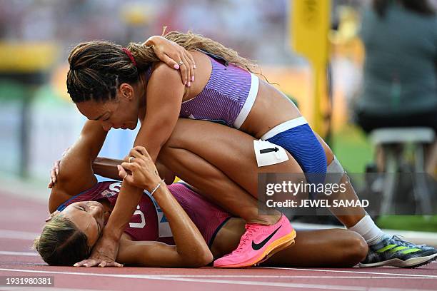 Britain's Katarina Johnson-Thompson and USA's Anna Hall react after the women's heptathlon 800m during the World Athletics Championships at the...