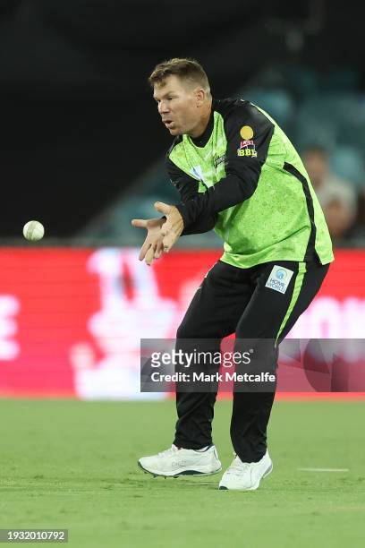 David Warner of the Thunder fields during the BBL match between Sydney Thunder and Adelaide Strikers at Manuka Oval, on January 14 in Canberra,...
