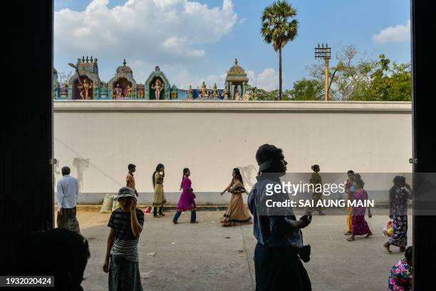 Myanmar Hindu devotees visit the Peelakkat temple during the annual bull taming 'Jallikattu' festival in Kyauktan township on the outskirts of Yangon...
