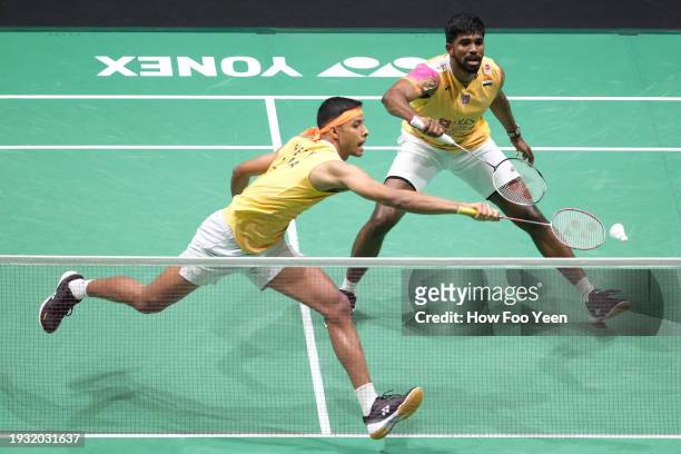 Satwiksairaj Rankireddy and Chirag Shetty of India in action against Liang Wei Keng and Wang Chang of Chinain their men doubles final during day 6 of...