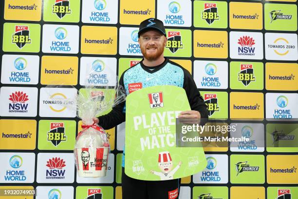 Lloyd Pope of the Strikers poses with the player of the match award during the BBL match between Sydney Thunder and Adelaide Strikers at Manuka Oval,...