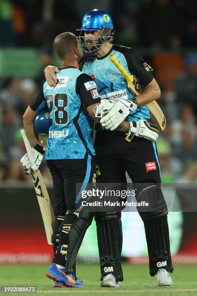 Matthew Short and Jake Weatherald of the Strikers celebrate victory during the BBL match between Sydney Thunder and Adelaide Strikers at Manuka Oval,...