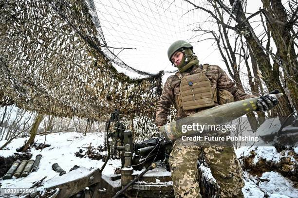 Serviceman of the 66th separate cannon artillery battalion of the 406th separate artillery brigade of the Armed Forces of Ukraine is pictured by the...