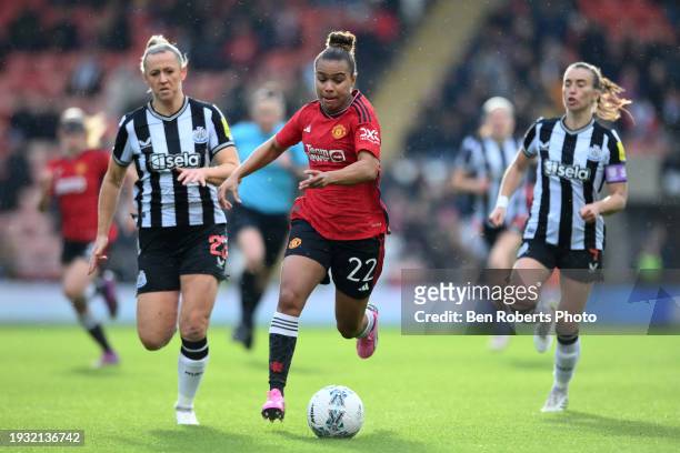 Nikita Parris of Manchester United runs with the ball whilst under pressure from Charlotte Potts of Newcastle United during the Adobe Women's FA Cup...
