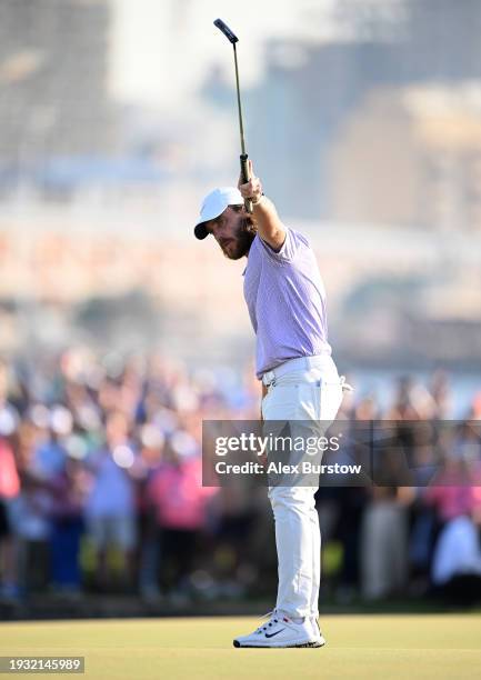 Tommy Fleetwood of England celebrates on the 18th green after winning the Dubai Invitational at Dubai Creek Golf and Yacht Club on January 14, 2024...