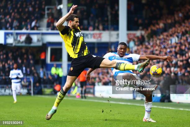 Sinclair Armstrong of Queens Park Rangers is challenged by Wesley Hoedt of Watford during the Sky Bet Championship match between Queens Park Rangers...