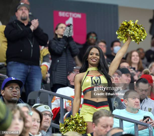 Member of the Vegas Golden Knights Vegas Vivas cheerleaders cheers in the stands before the team's game against the Calgary Flames at T-Mobile Arena...