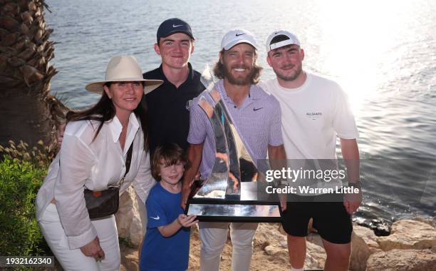 Tommy Fleetwood of England and his family pose with the trophy after winning the Dubai Invitational at Dubai Creek Golf and Yacht Club on January 14,...