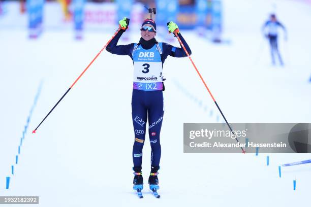 Lisa Vittozzi of Team Italy celebrates as she crosses the line after winning the Women 10 km Pursuit at the BMW IBU World Cup Biathlon Ruhpolding on...