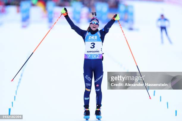 Lisa Vittozzi of Team Italy celebrates as she crosses the line after winning the Women 10 km Pursuit at the BMW IBU World Cup Biathlon Ruhpolding on...