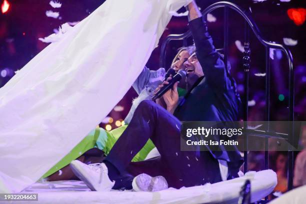 Swiss singer Beatrice Egli and German singer and presenter Florian Silbereisen perform during the Schlagerchampions Das grosse Fest der Besten at...