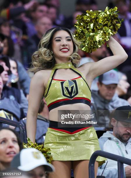 Member of the Vegas Golden Knights Vegas Vivas cheerleaders cheers in the stands before the team's game against the Calgary Flames at T-Mobile Arena...