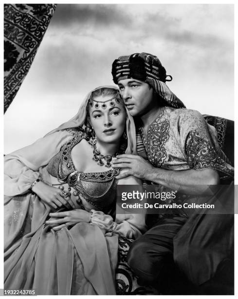 Publicity portrait of actor Eleanor Parker as 'Joan Carlisle/Sarah Gray' and Anthony Dexter in his second cinematic role, as 'Rudolph Valentino' in...