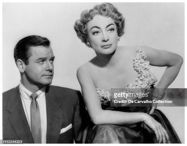 Publicity portrait of actors Gig Young as 'Cliff Willard' and Joan Crawford in her first Technicolor film, as 'Jenny Stewart' in the film 'Torch...