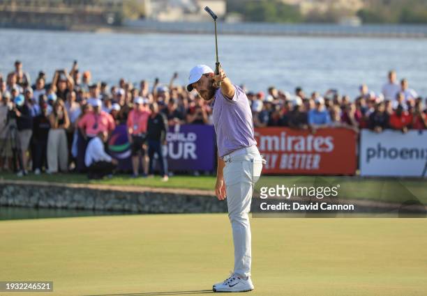Tommy Fleetwood of England celebrates holing the wining putt on the 18th green during the final round of the Dubai Invitational at Dubai Creek Golf...
