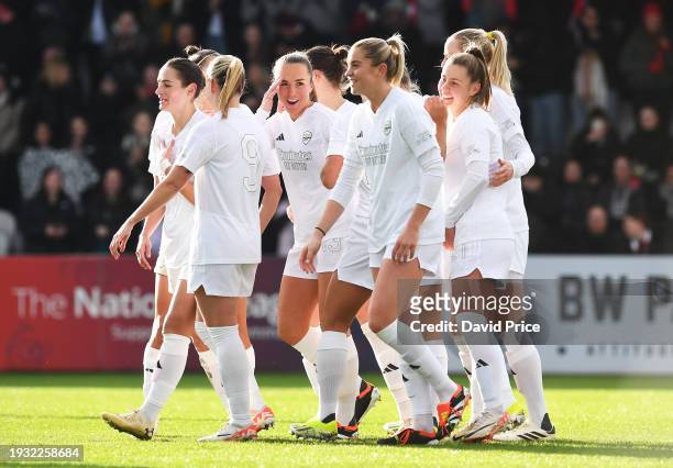 Lia Waelti of Arsenal celebrates with teammates after scoring the team's second goal during the Adobe Women's FA Cup Fourth Round match between...