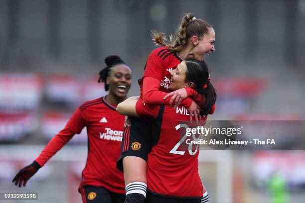 Rachel Williams of Manchester United celebrates scoring their team's fourth goal with team mate Irene Guerrero during the Adobe Women's FA Cup Fourth...