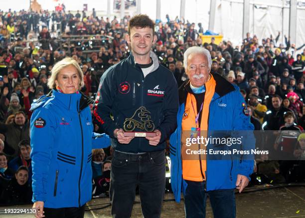 The former president of Turismoto, Emilio Simo presents the Pinguino de Oro award to rider Victor Lopez during the Pinguinos de Oro awards ceremony...