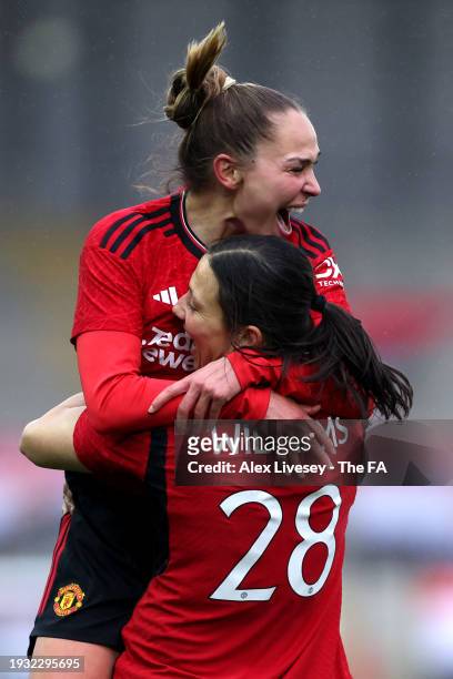 Rachel Williams of Manchester United celebrates scoring their team's fourth goal with team mate Irene Guerrero during the Adobe Women's FA Cup Fourth...
