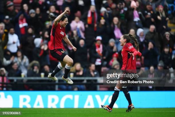 Rachel Williams of Manchester United celebrates scoring their team's fourth goal with team mate Irene Guerrero during the Adobe Women's FA Cup Fourth...