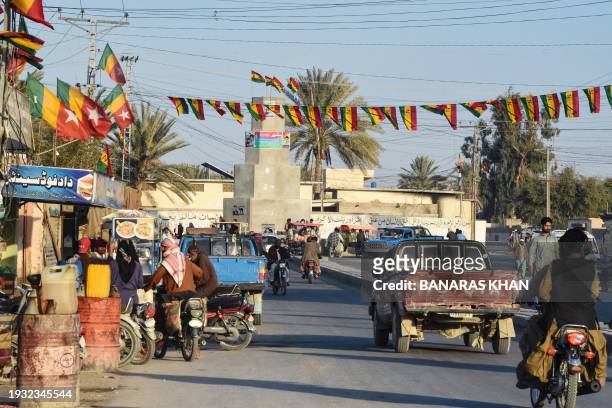 Commuters ride along a street at Panjgur district in Balochistan province on January 17, 2024. Pakistan recalled its ambassador from Iran on January...