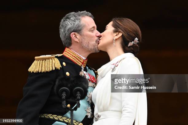 Danish King Frederik X and wife Queen Mary of Denmark kiss after their proclamation by the Prime Minister, Mette Frederiksen on the balcony of...