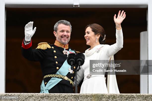 Danish King Frederik X and wife Queen Mary of Denmark wave after their proclamation by the Prime Minister, Mette Frederiksen on the balcony of...